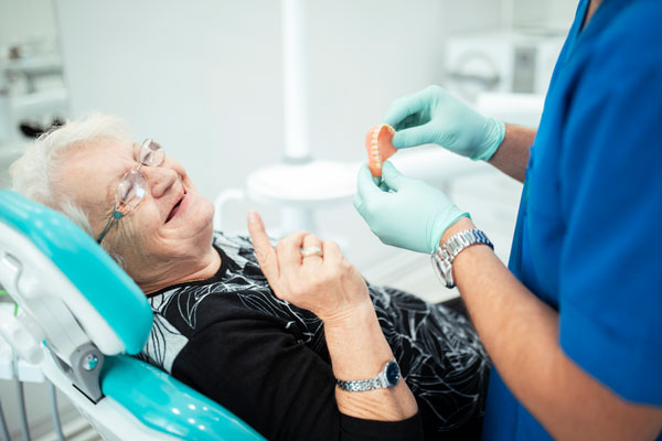women getting dentures fitted